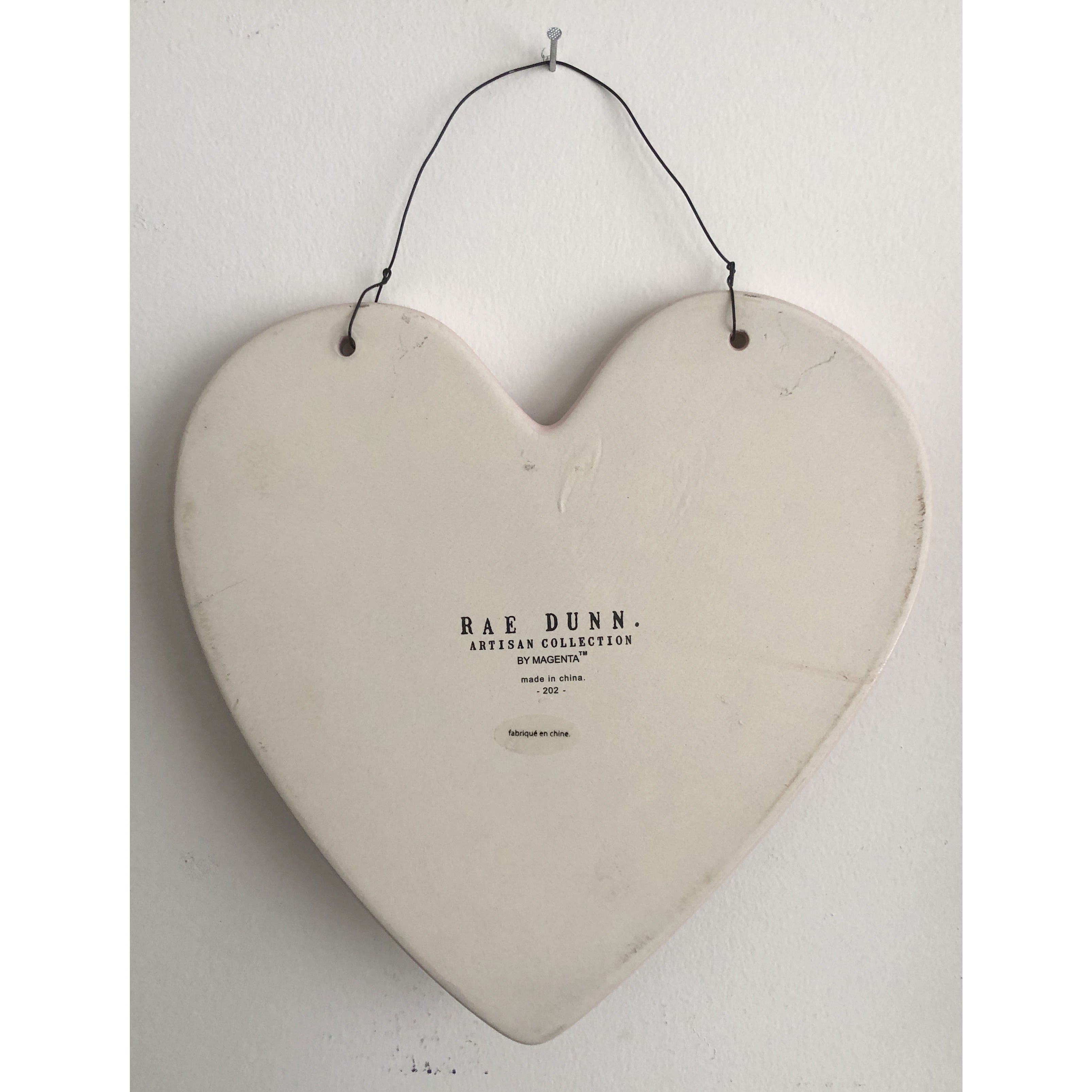 Rae Dunn Heart Shaped Ceramic Wall Hanging in Pink with Love In Black Font